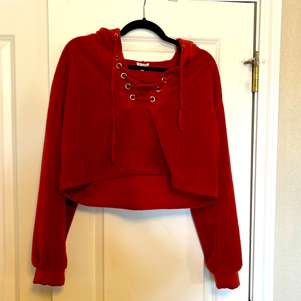 This is an En Crème red hoodie sweatshirt